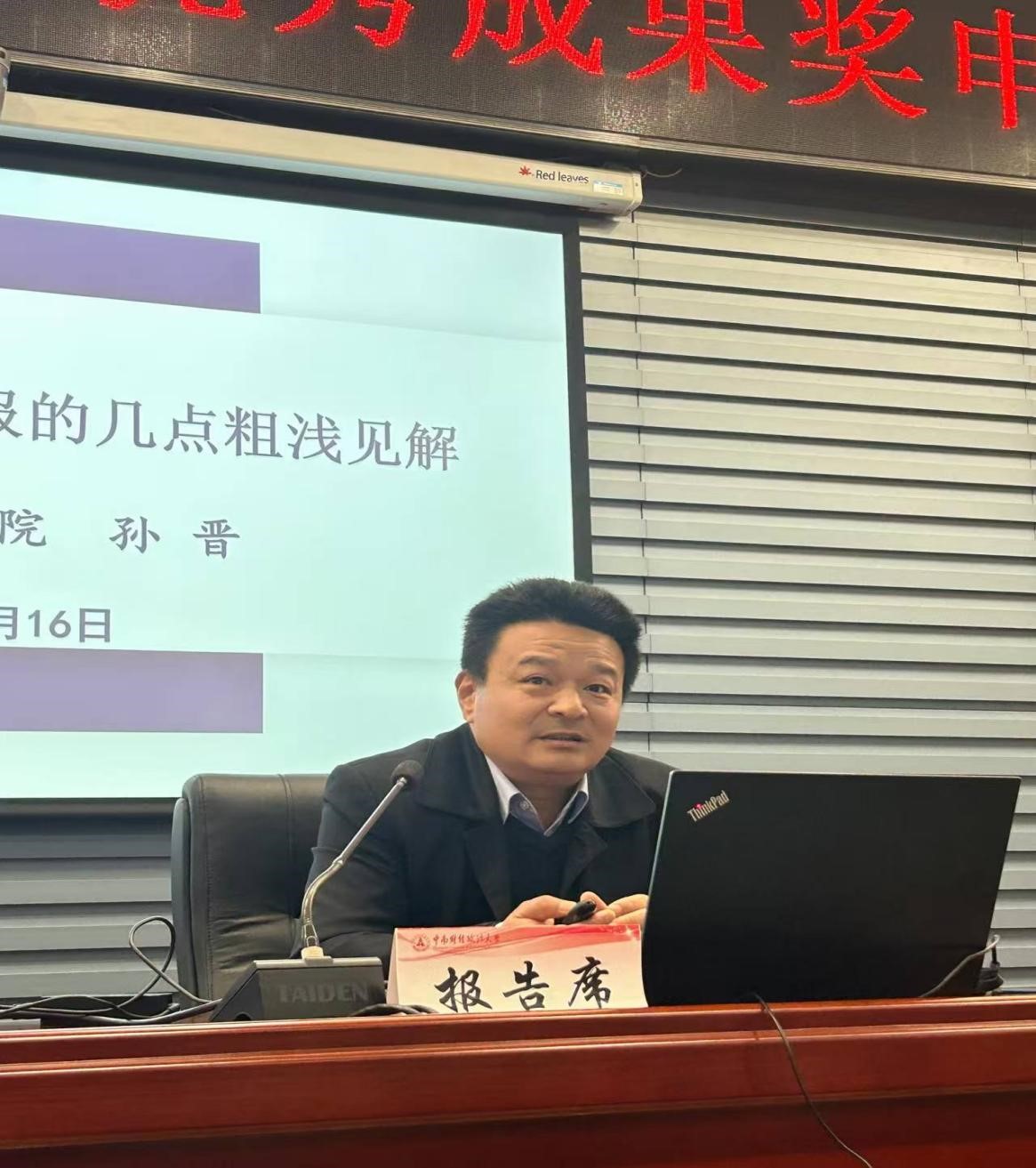 A person sitting at a desk with a computer  AI-generated content may be incorrect.